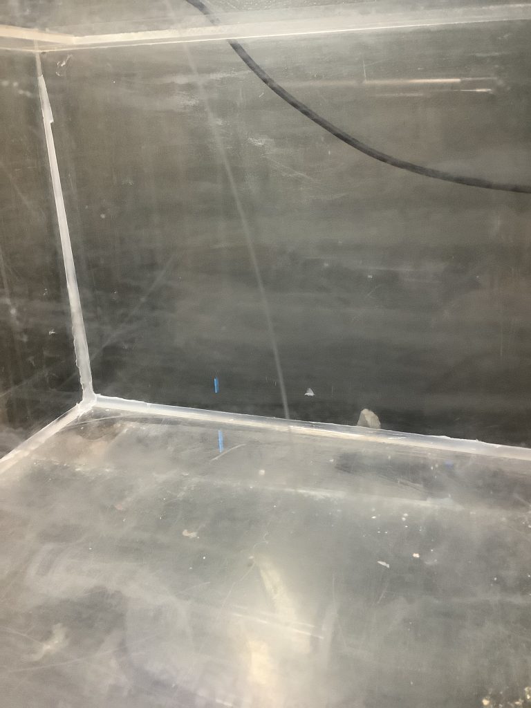Acrylic surface with noticeable fine scratches and cloudiness